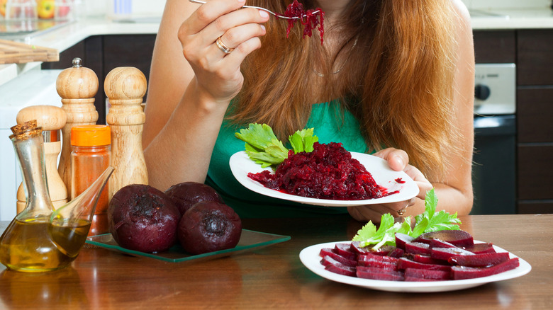 Person eating raw beets