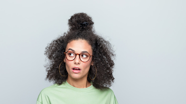 Young woman looking confused
