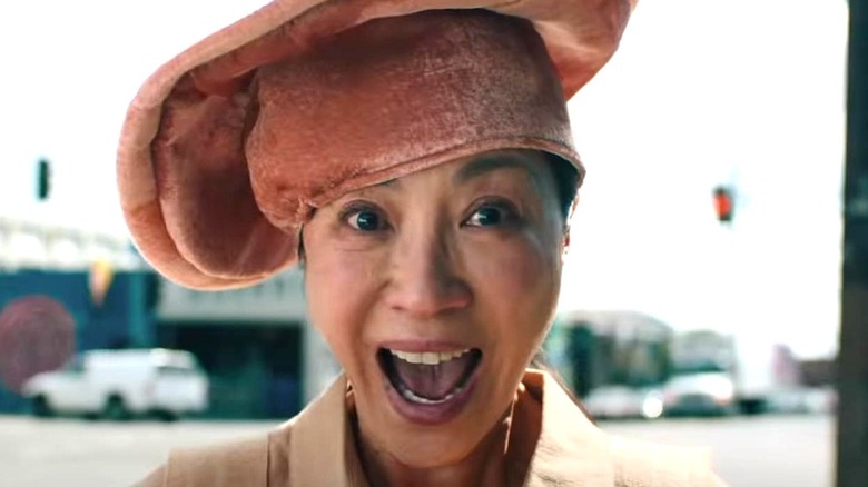 Michelle Yeoh's Evelyn Wang looking happy in Everything Everywhere All at Once
