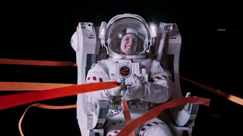 Jessica Chastain's Melissa Lewis holding to a tether while wearing a spacesuit in The Martian