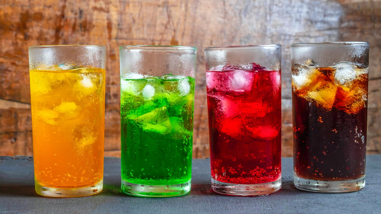 Various colors of drinks containing lots of ice