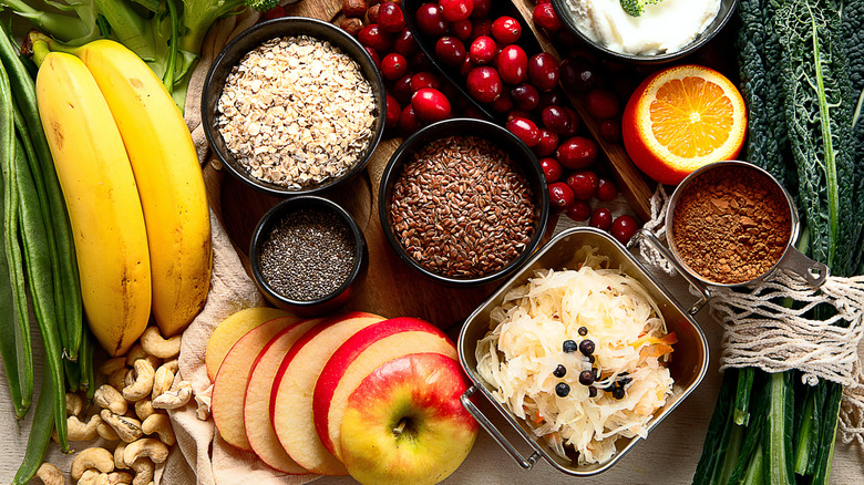 A collection of high fiber foods like fruit, vegetables, and whole grains