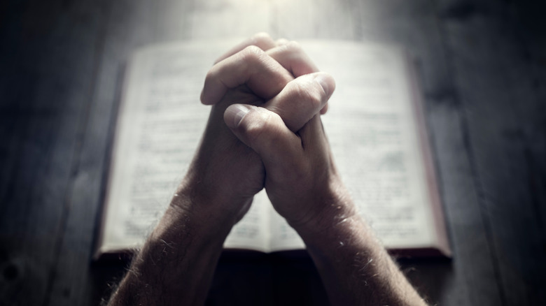 Hands folded in prayer