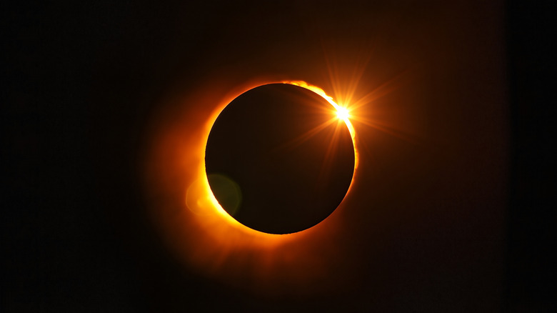 Total solar eclipse, with the ring of the sun glowing behind the moon