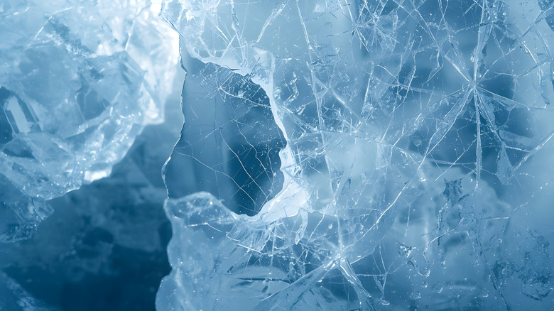 A large sheet of ice with light refracting through it.