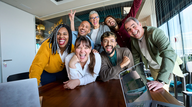 Happy coworkers in a group photo in the office