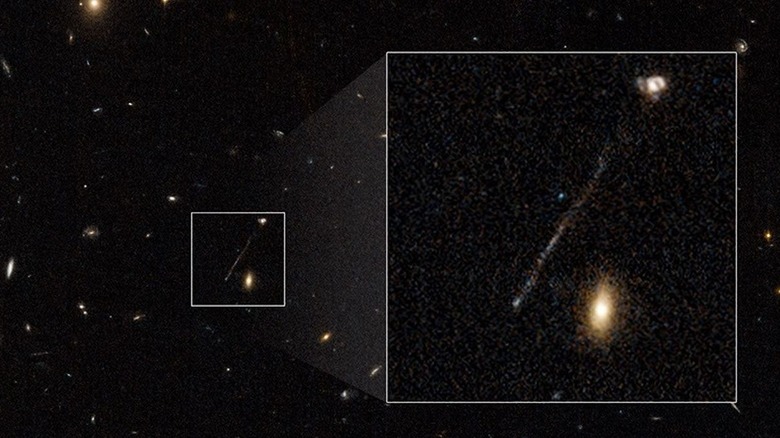 JWST deep space image of galaxies with box highlighting a trail of stars