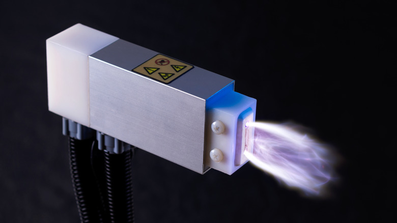 A device producing a purple, cold plasma ray