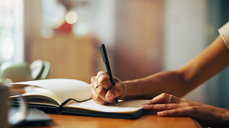 woman writing with her right hand