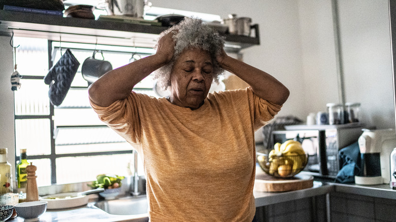 Person looking worried after forgetting something
