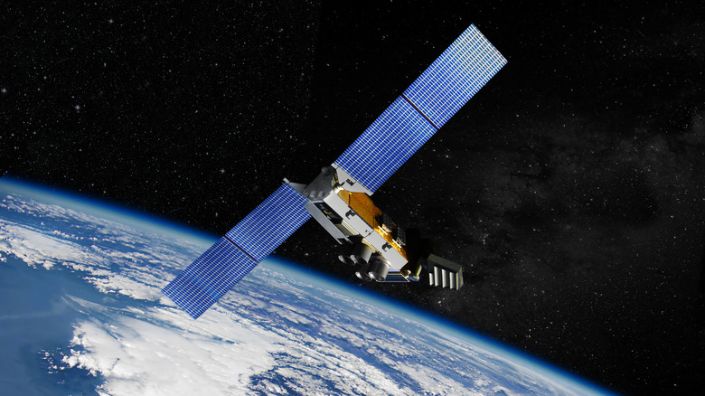 3D render of a satellite with large solar panels in orbit above Earth