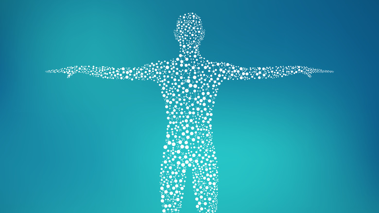 The figure of a man made up of atoms