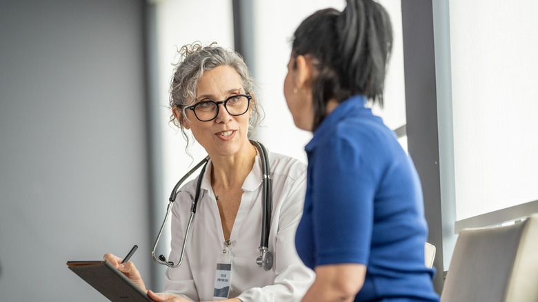 Doctor talking with a female patient