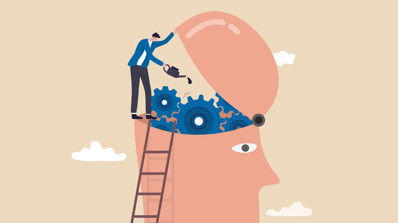 Illustration showing a person on a ladder oiling gears inside a stylized human head.