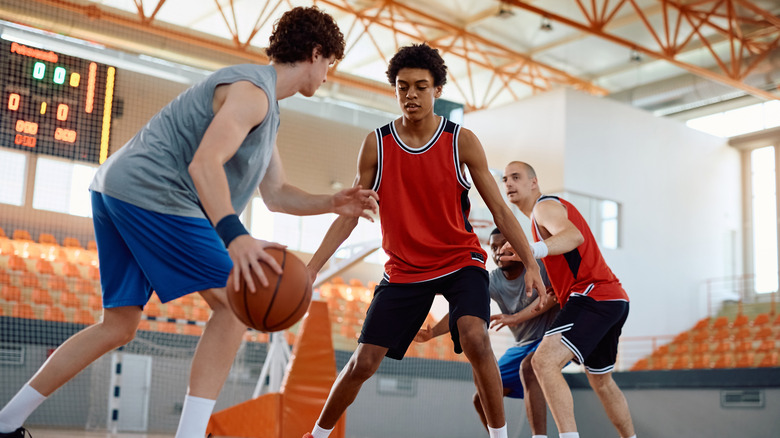 Basketball players on court