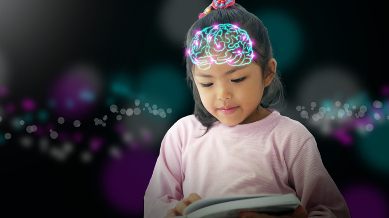 Young girl reading a book with an overlayed image of a glowing brain