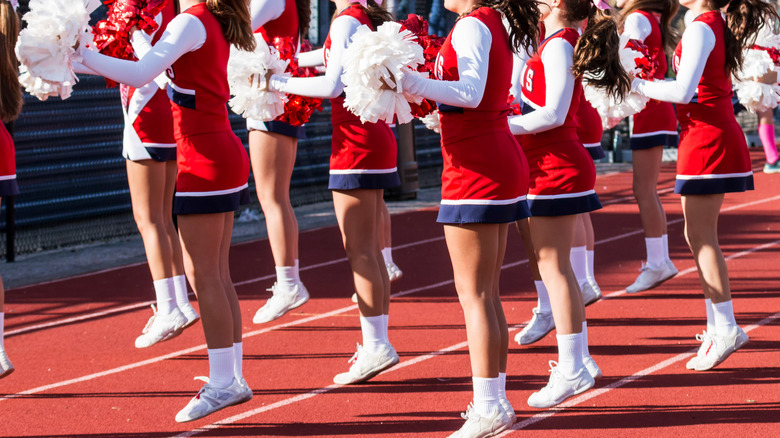 group of cheerleaders jumpbing