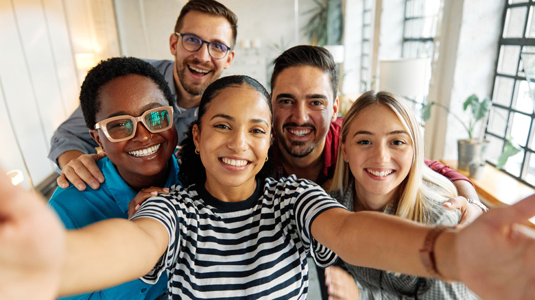 person taking a group selfie
