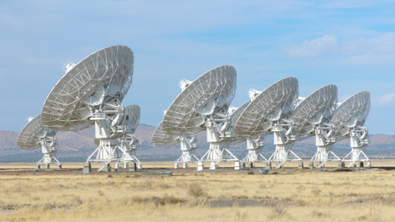 Array of radio telescope dishes surveying the sky