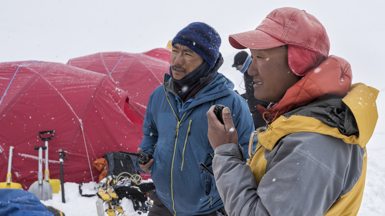 pair of Sherpas outside tent on Mount Everest