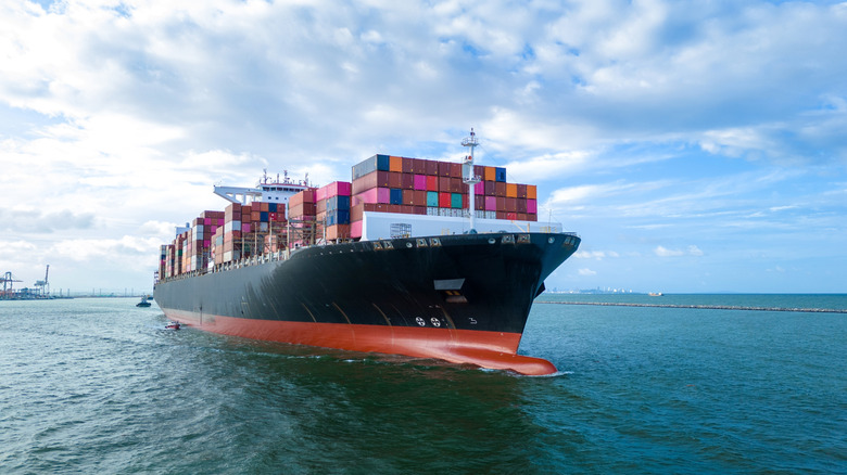 Shipping vessel loaded with many cargo containers
