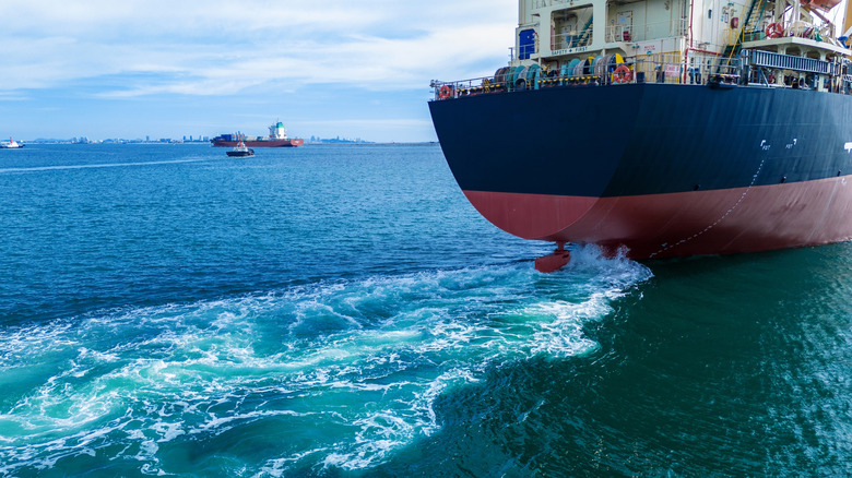 Propeller of ship leaving a wake in the water