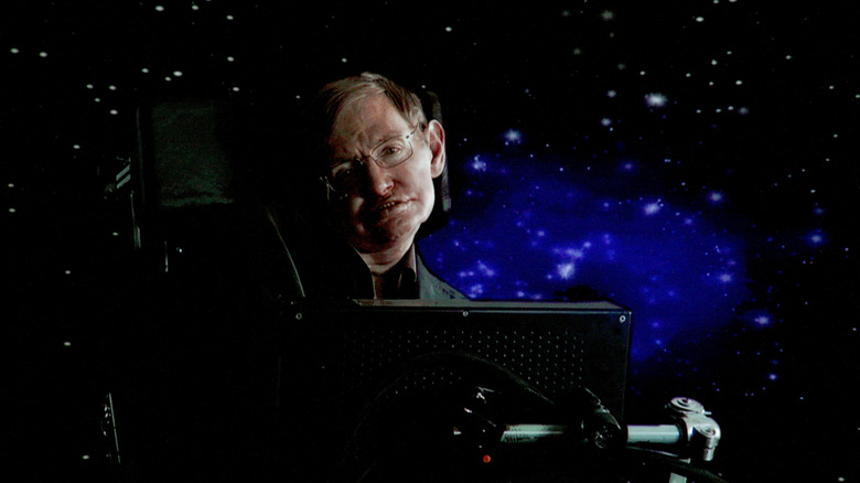 Stephen Hawking in front of space graphic background