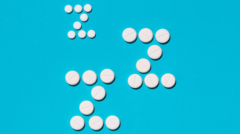 Various sleeping pills arranged into Zs to represent sleep