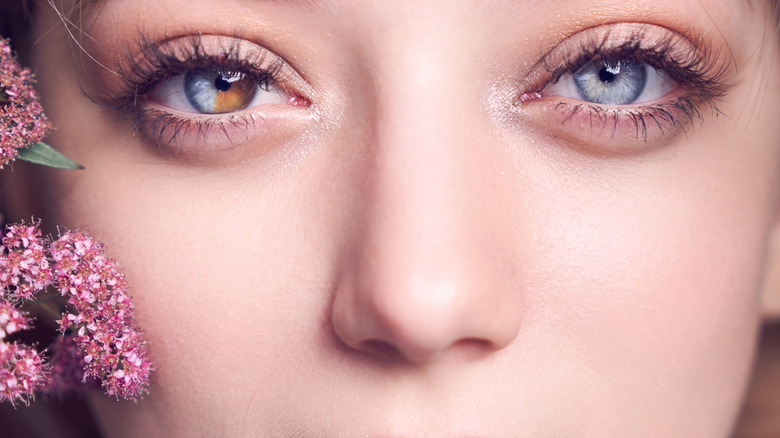 A girl with heterochromia in her eyes looking at the camera