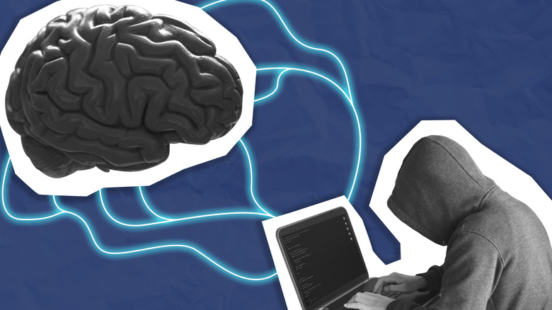 Concept of a hacker using a laptop to hack into a brain