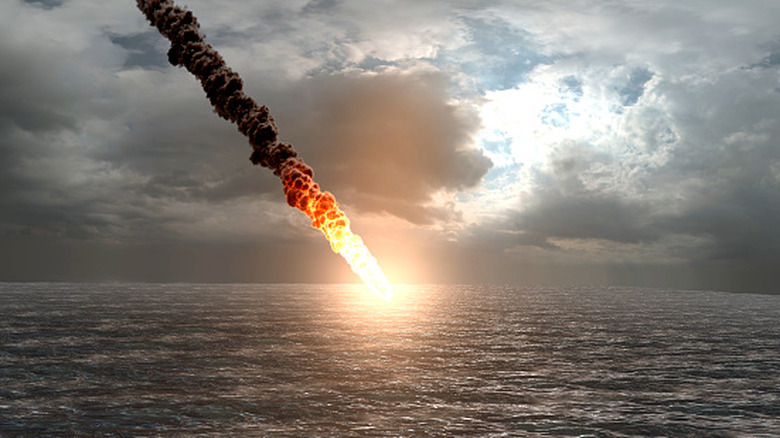 Flaming object falling into the ocean