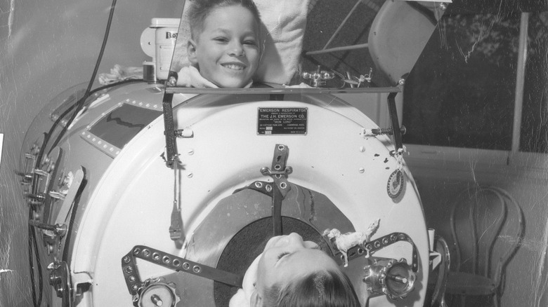 A boy in an iron lung circa 1955