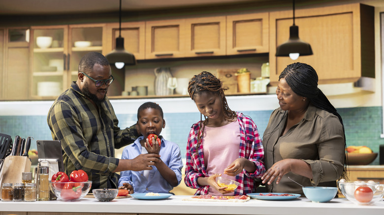 Family preparing home cooked food together