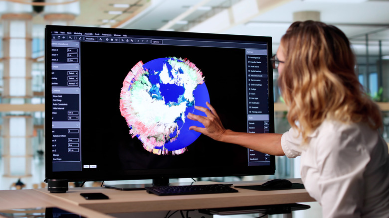 Woman analyzing hurricane data on a computer