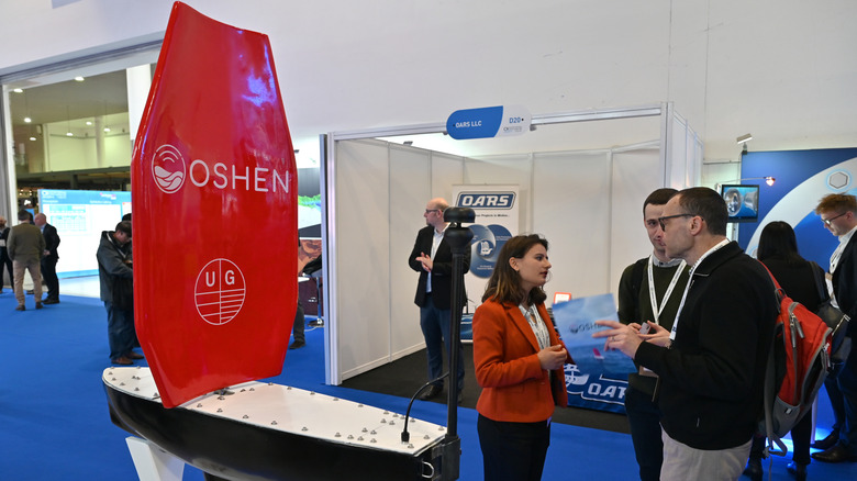 A model of an OSHEN boat at a conference center