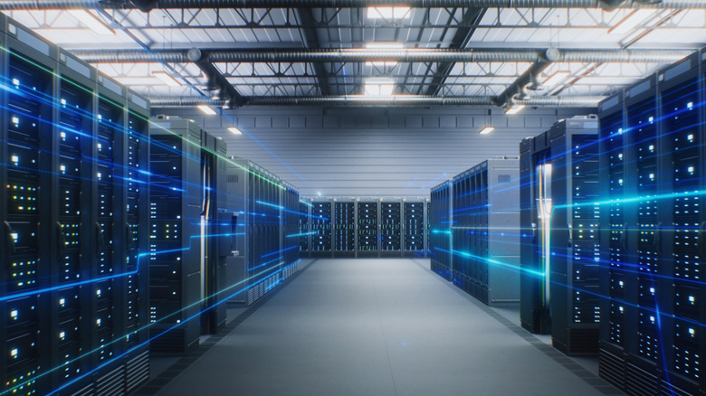 The interior of a Data Center reveals rows of server racks in a big warehouse
