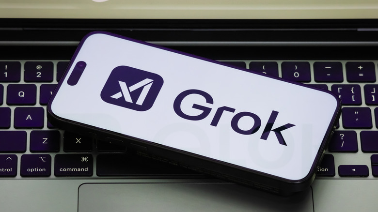 A smartphone displaying the Grok logo