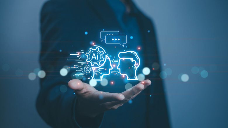 Man holding a concept of artificial intelligence in his hand