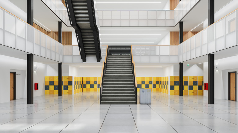 Bright and empty school corridor with stairs