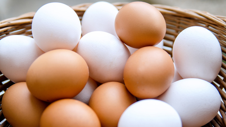 A basket of brown and white eggs