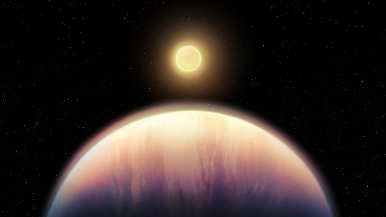 A star is seen in the distance with a planet in the foreground