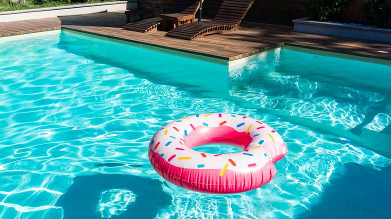 pink donut floatation device in swimming pool