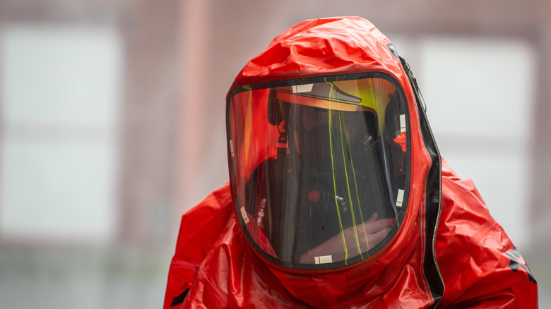 Firefighter in a red hazmat protection suit