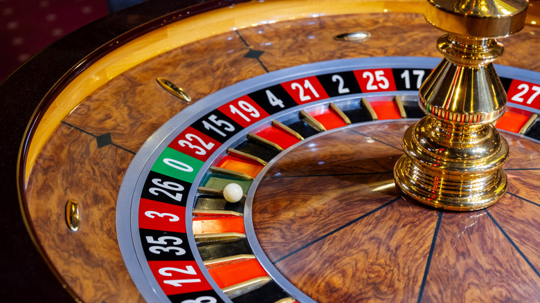 roulette wheel with ball on black