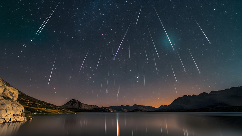 Perseid meteor shower over mountain lake