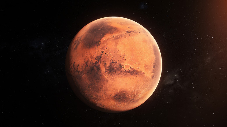 Mars is seen against a black background