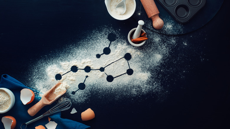 Food is arranged on a cutting board with the outline of a constellation drawn in flour