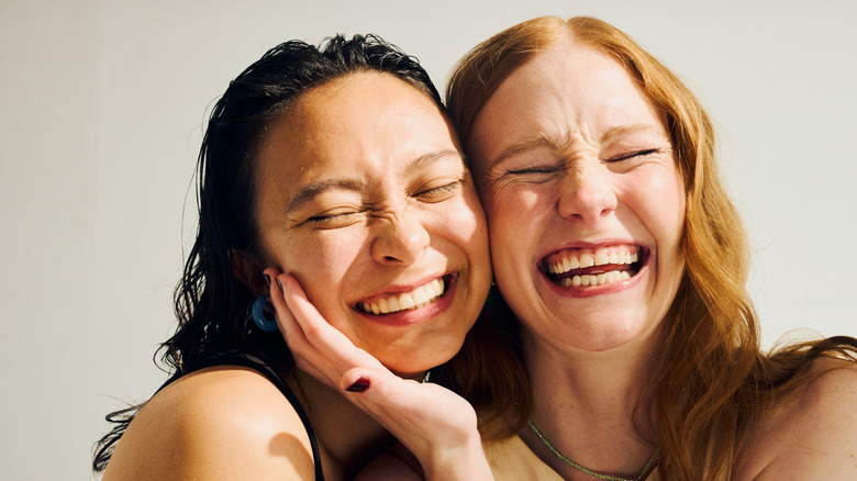 two women laughing together