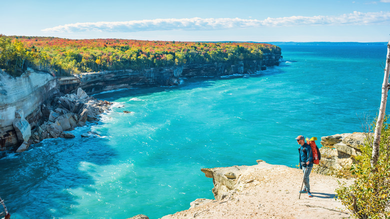 Someone hiking along the shore of Lake Superior in Michigan.