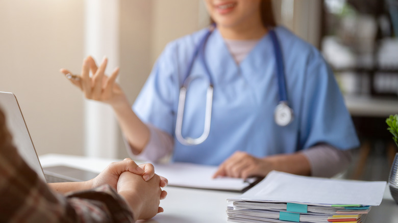 Doctor consulting with a patient in their office